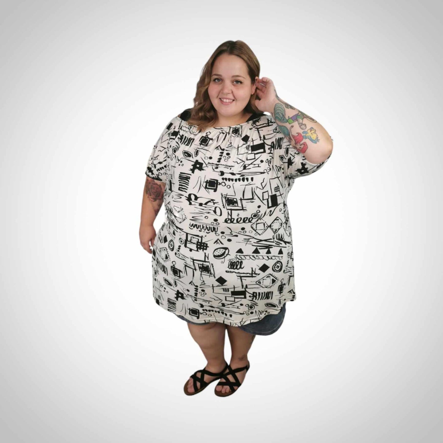 Chandail taille plus long col et manches élastiques imprimé sur blanc