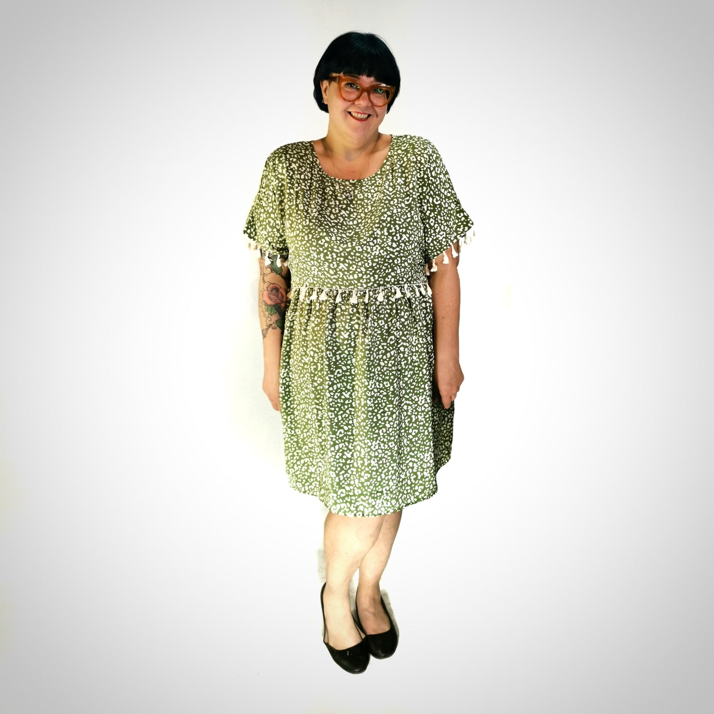 Robe léopard vert à pompons