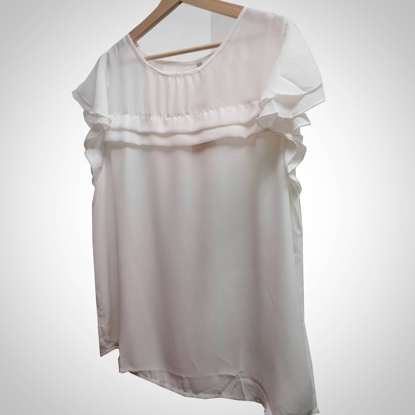 White blouse with frilly sleeves